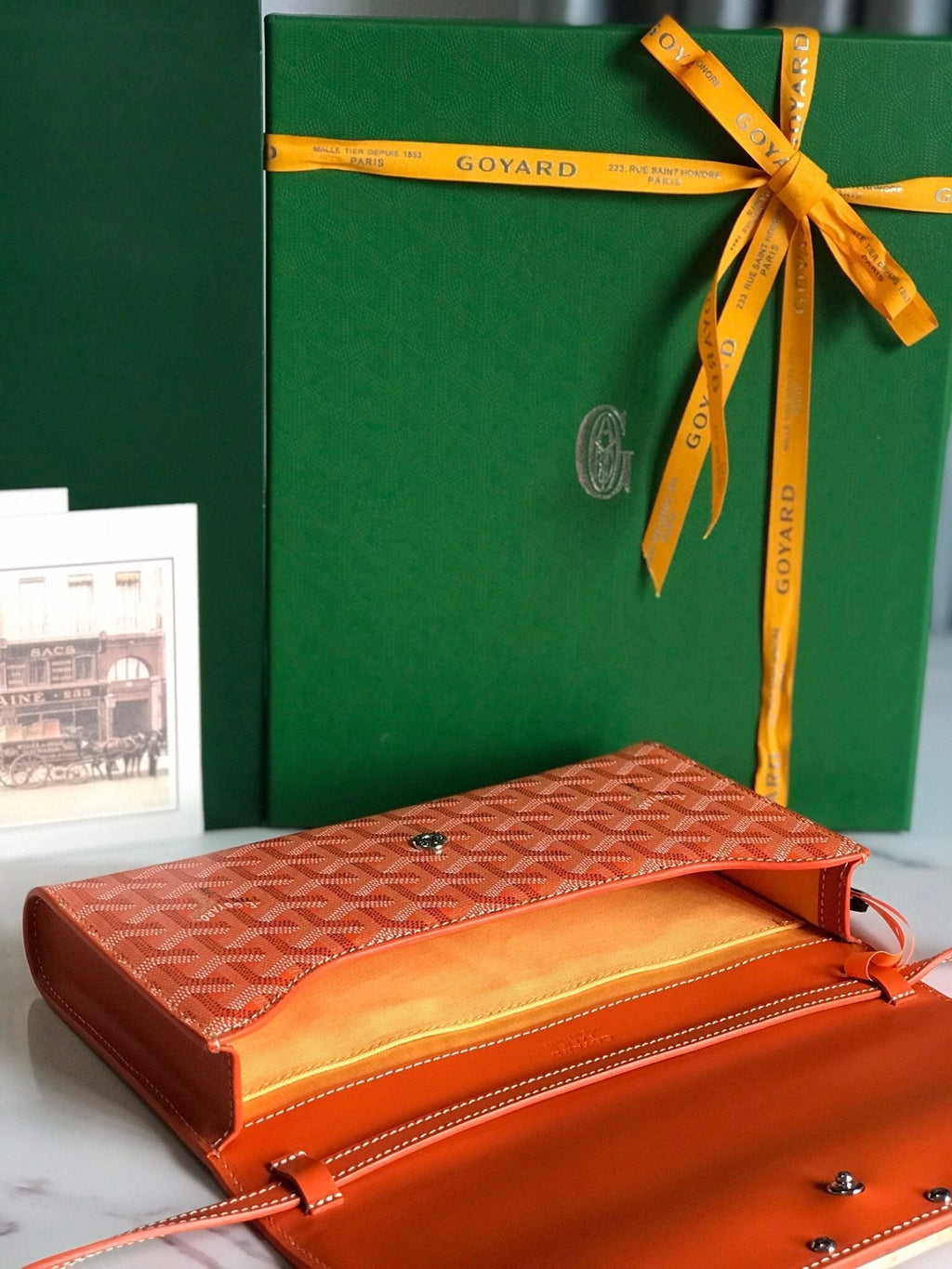 MONTE-CARLO PM CLUTCH 25 IN ORANGE GOYARDINE CANVAS