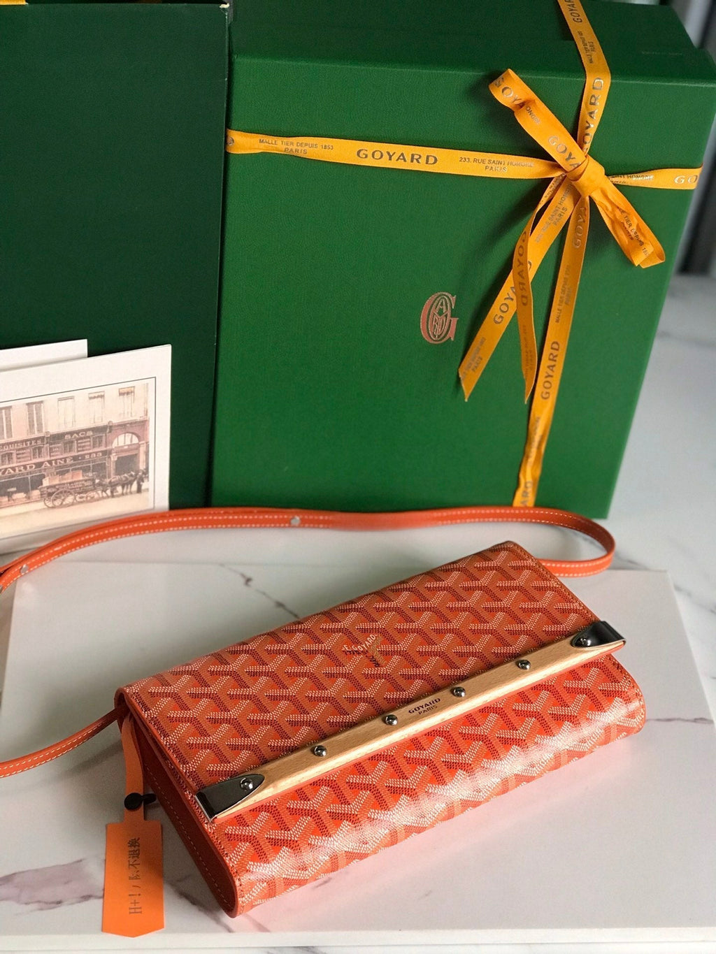 MONTE-CARLO PM CLUTCH 25 IN ORANGE GOYARDINE CANVAS