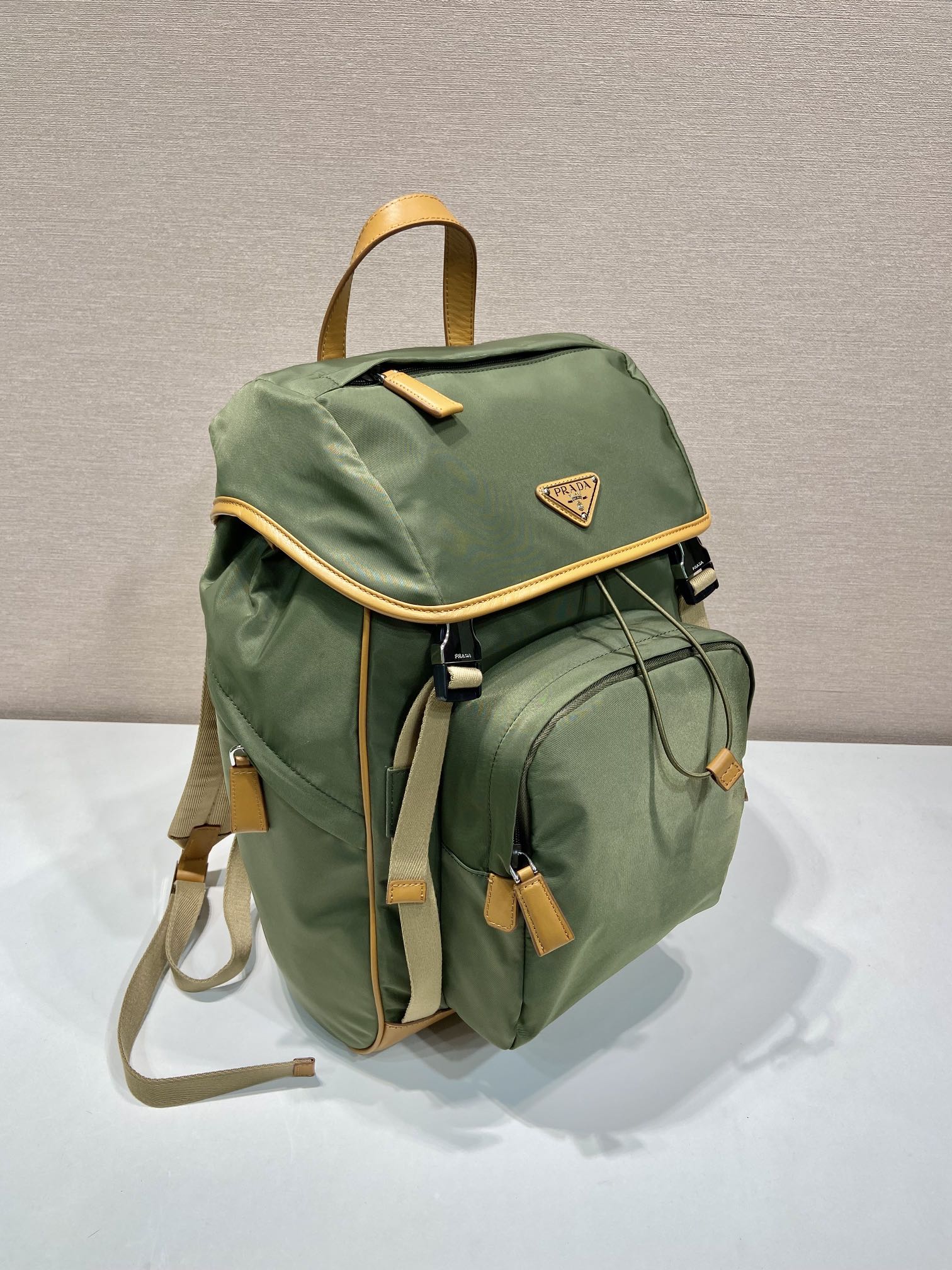 PRADA BACKPACK 45 IN SEAWEED GREEN RE-NYLON AND BROWN CALFSKIN TRIM