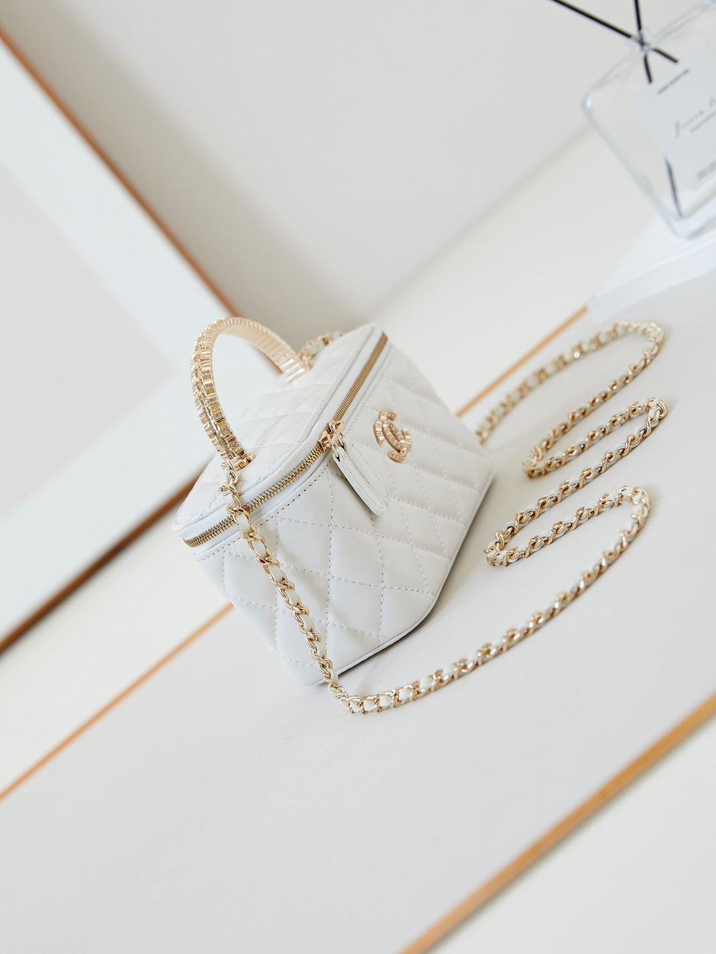 CHANEL 25S MINI VANITY BAG 16 CM IN WHITE LAMBSKIN WITH CRYSTAL-EMBELLISHED  LOGO