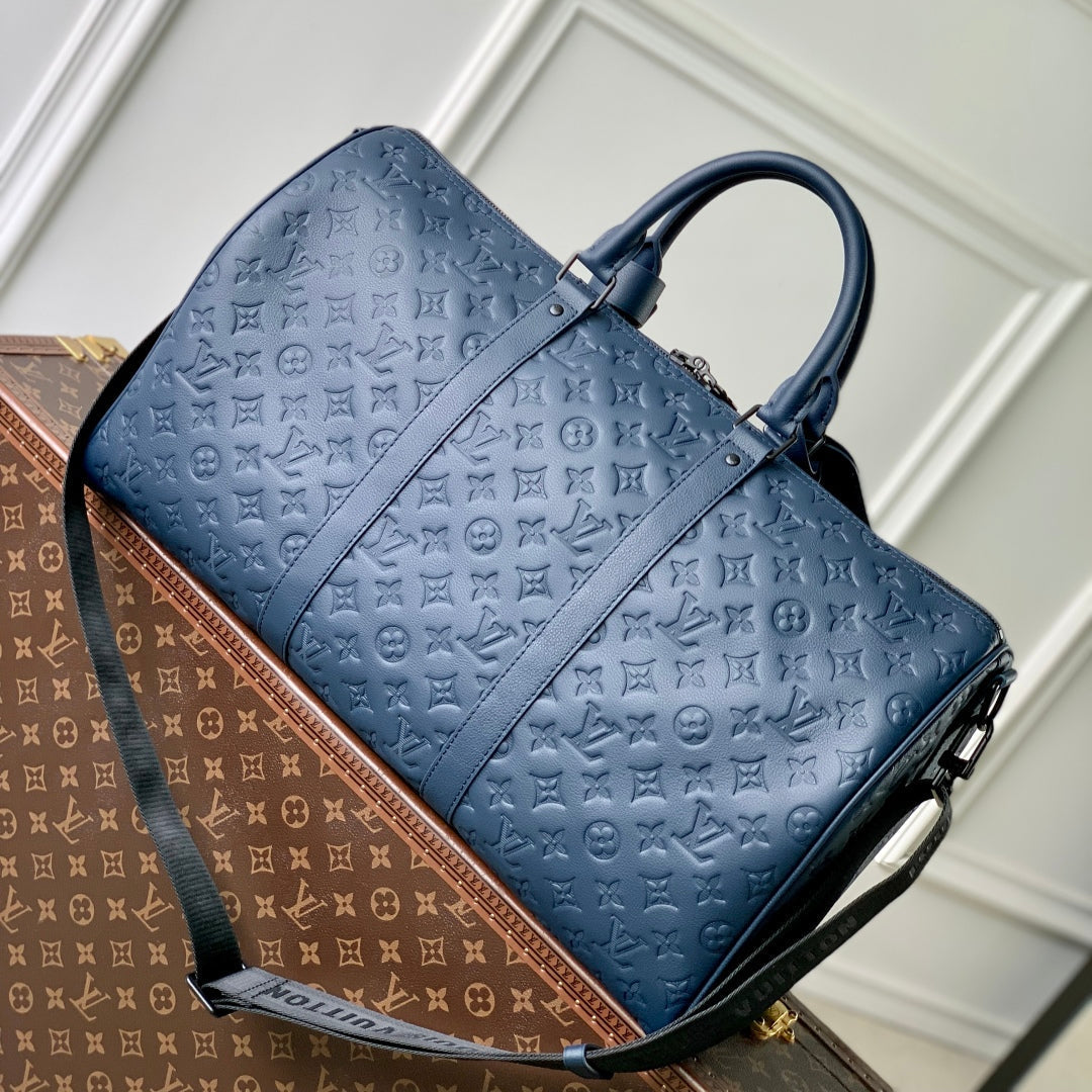 LOUIS VUITTON KEEPALL BANDOULIÈRE 50 IN DARK BLUE MONOGRAM SHADOW EMBOSSED CALFSKIN