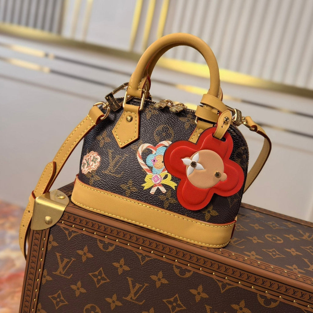LOUIS VUITTON LV 25S NANO ALMA 18 IN BROWN MONOGRAM CANVAS PRINTED WITH THE VIVIENNE MASCOT