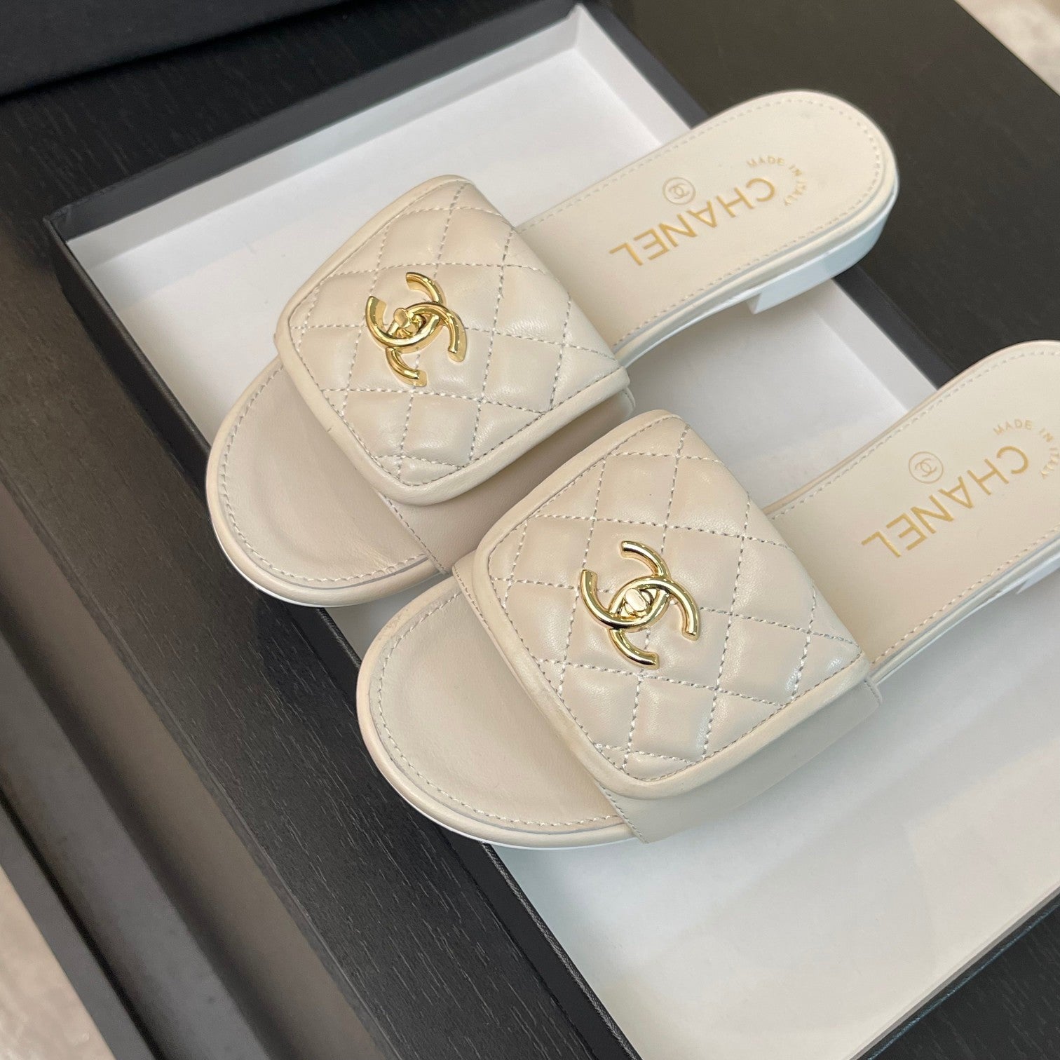 CHANEL FLAT MULE IN WHITE LAMBSKIN