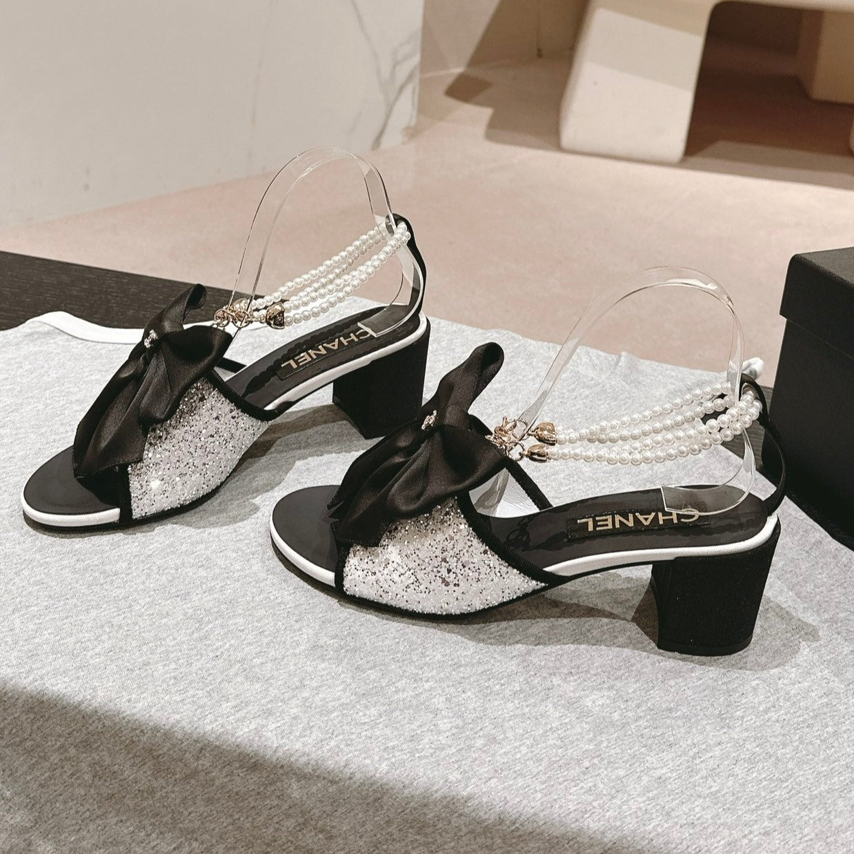 CHANEL HIGH SANDAL WITH PEARL CHAIN BLACK LAMBSKIN WITH WHITE RHINESTONES